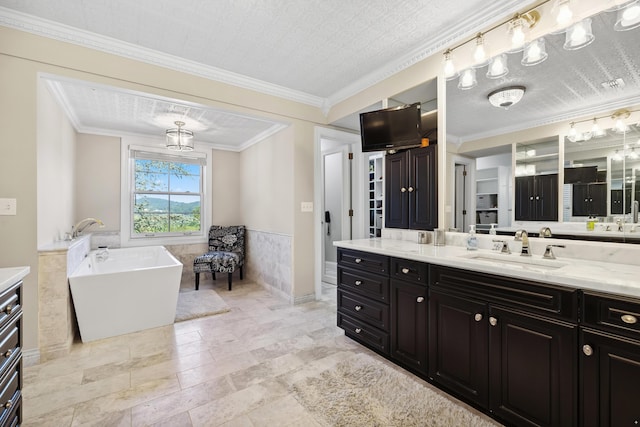 1442 Darbee Dr, Morristown, TN 37814 - full bath featuring wainscoting, vanity, a freestanding bath, tile walls, and crown molding
