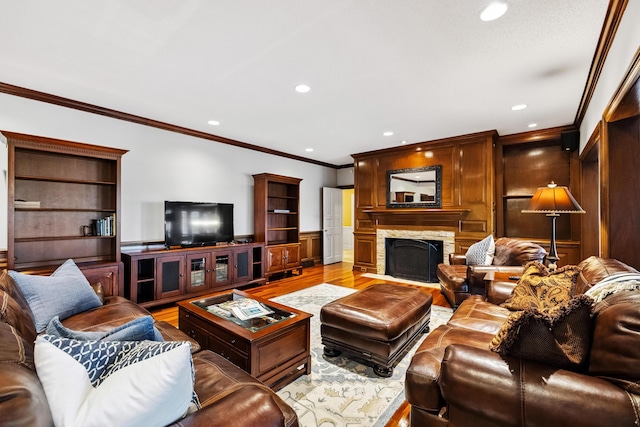 1442 Darbee Dr, Morristown, TN 37814 - living room with light wood-style floors, ornamental molding, recessed lighting, and a stone fireplace