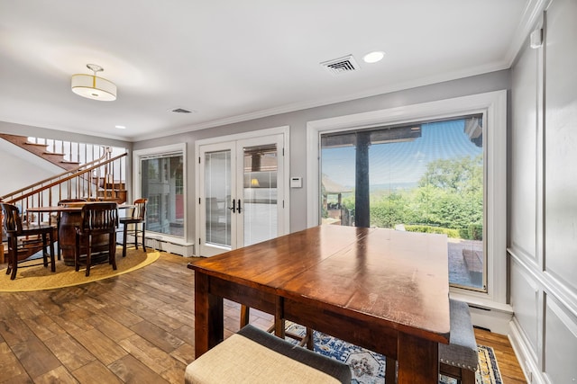 1442 Darbee Dr, Morristown, TN 37814 - dining room featuring wood finished floors, crown molding, french doors, and stairs