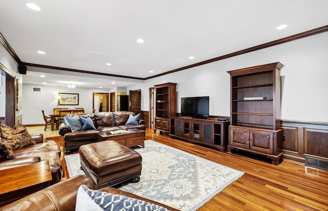 1442 Darbee Dr, Morristown, TN 37814 - living room featuring crown molding, recessed lighting, light wood finished floors, and wainscoting