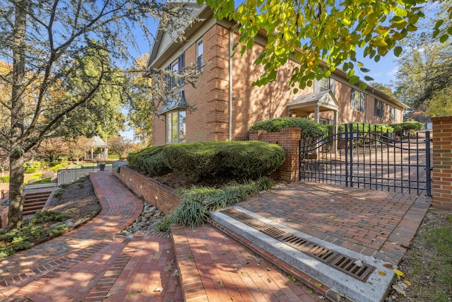 1442 Darbee Dr, Morristown, TN 37814 - view of property exterior with a gate and brick siding