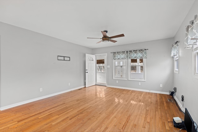 unfurnished room with ceiling fan and light wood-type flooring