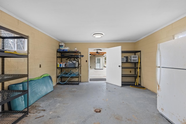 3569 Leadvale Rd, White Pine, TN 37890 - garage featuring freestanding refrigerator and concrete block wall