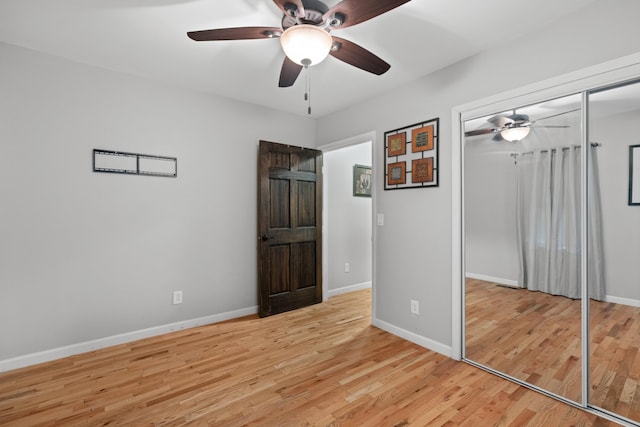 unfurnished bedroom with a closet, ceiling fan, and light hardwood / wood-style flooring