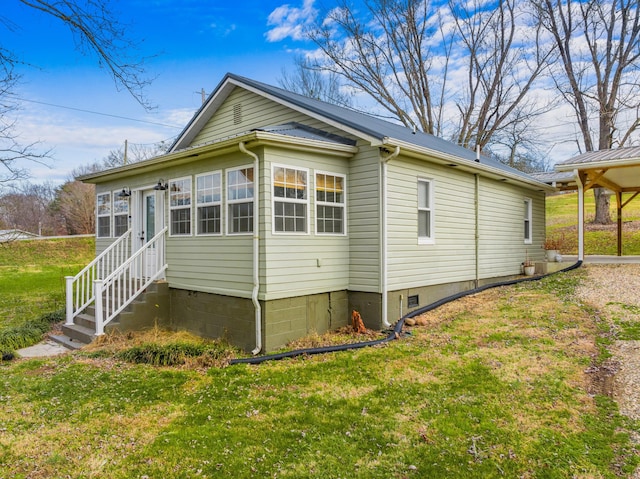 view of home's exterior with a yard