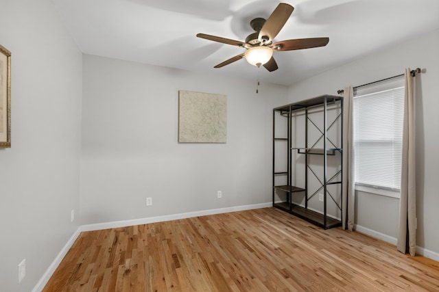 unfurnished bedroom with ceiling fan and light wood-type flooring