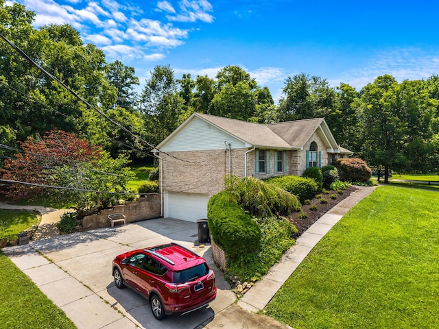 822 Osprey Dr, Morristown, TN 37814 - view of property exterior featuring concrete driveway, a lawn, brick siding, and an attached garage