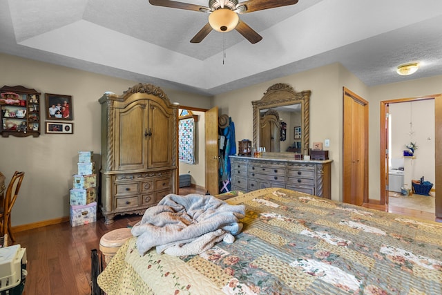 822 Osprey Dr, Morristown, TN 37814 - bedroom with a tray ceiling, wood finished floors, a textured ceiling, and a ceiling fan