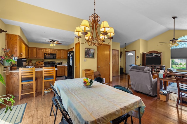 822 Osprey Dr, Morristown, TN 37814 - dining area featuring a ceiling fan, light wood finished floors, lofted ceiling, and a chandelier