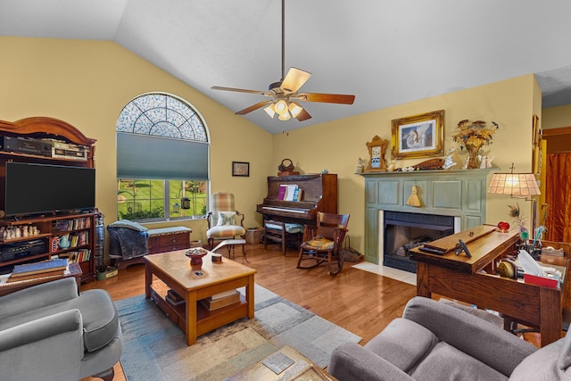 822 Osprey Dr, Morristown, TN 37814 - living area featuring lofted ceiling, a ceiling fan, wood finished floors, and a fireplace with flush hearth