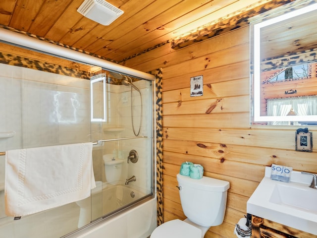 full bathroom with bath / shower combo with glass door, wooden walls, wooden ceiling, and toilet