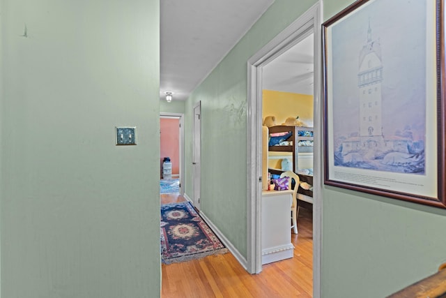 hall with light hardwood / wood-style flooring