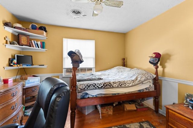 bedroom featuring ceiling fan and wood-type flooring