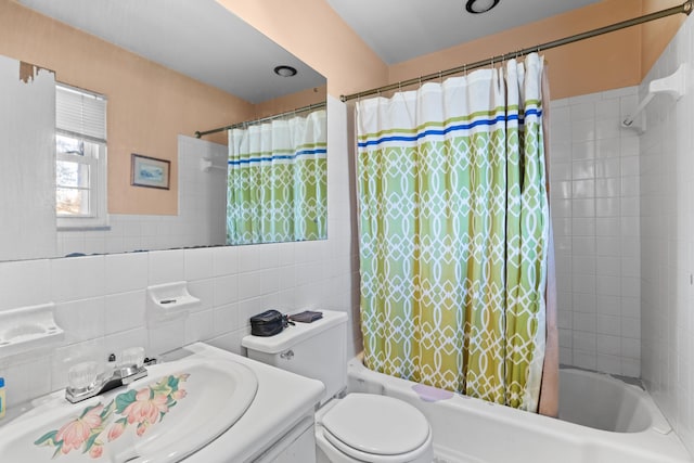 full bathroom with vanity, shower / tub combo, decorative backsplash, tile walls, and toilet