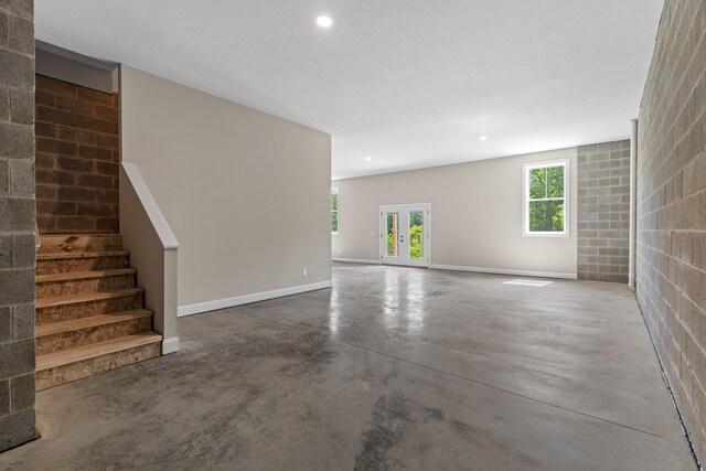 3183 Bridgewater Blvd, Morristown, TN 37814 - unfurnished living room with stairway, baseboards, recessed lighting, and finished concrete floors
