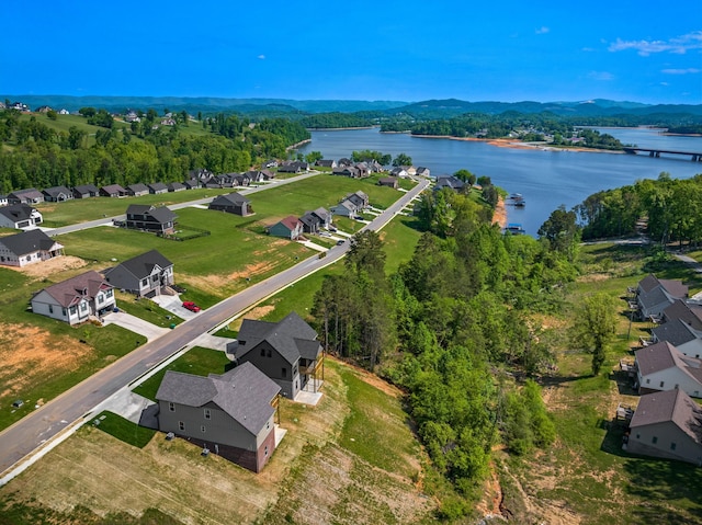 bird's eye view featuring a water view and a residential view