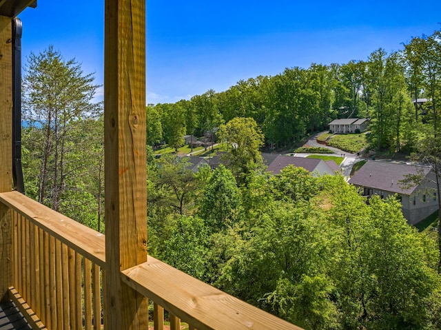 exterior space featuring a wooded view