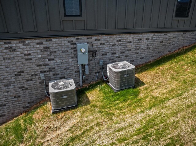 3183 Bridgewater Blvd, Morristown, TN 37814 - exterior details with brick siding, board and batten siding, and central air condition unit