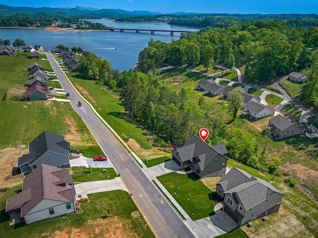 birds eye view of property with a residential view and a water view
