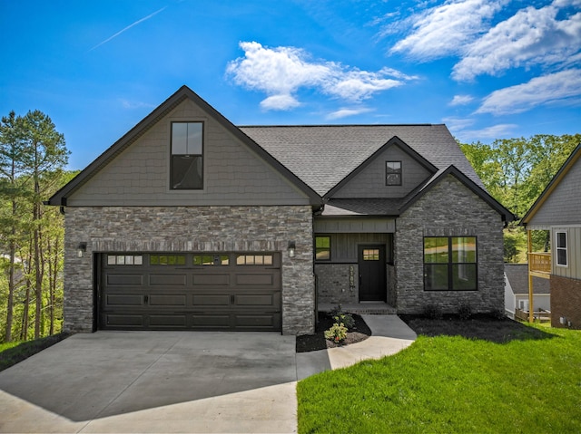 craftsman inspired home with a shingled roof, a front lawn, stone siding, and concrete driveway