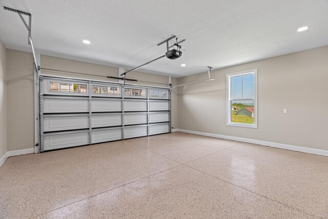 3183 Bridgewater Blvd, Morristown, TN 37814 - garage featuring baseboards, a garage door opener, and recessed lighting