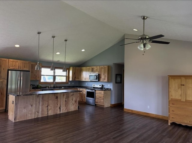 639 Mcguire Rd, New Market, TN 37820 - kitchen featuring stainless steel appliances, dark countertops, dark wood-style flooring, a center island, and ceiling fan