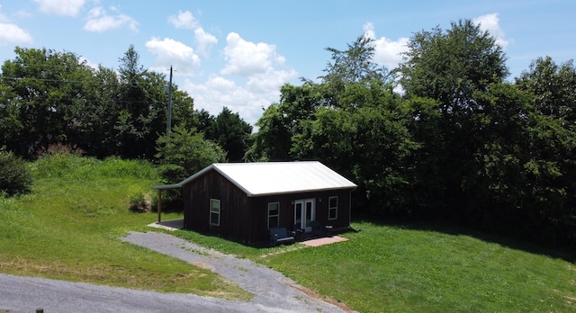 639 Mcguire Rd, New Market, TN 37820 - view of home's exterior with a yard and a metal roof