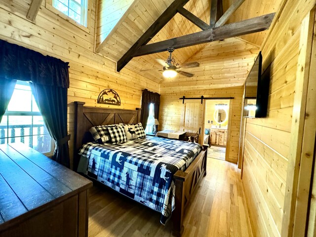 2119 Ted Moore Rd, Dandridge, TN 37725 - bedroom with wooden walls, a barn door, hardwood / wood-style flooring, high vaulted ceiling, and wooden ceiling with exposed beams