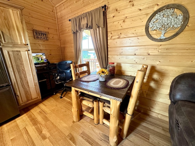 2119 Ted Moore Rd, Dandridge, TN 37725 - dining room featuring wood walls and light wood-style floors