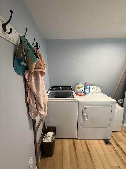 136 Stonewall Way, Cosby, TN 37722 - laundry room with laundry area, light wood finished floors, and independent washer and dryer