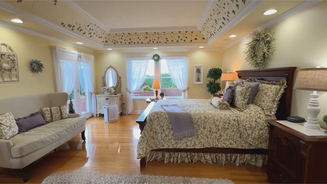 1564 Tranquility Trl, Dandridge, TN 37725 - bedroom featuring ornamental molding, light wood-style floors, a tray ceiling, and recessed lighting