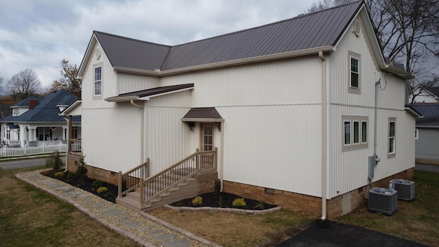 view of home's exterior featuring cooling unit