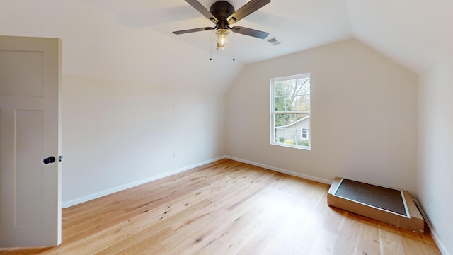 bonus room featuring light hardwood / wood-style flooring, vaulted ceiling, and ceiling fan