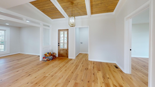 entryway with a notable chandelier, lofted ceiling with beams, light hardwood / wood-style floors, and wood ceiling