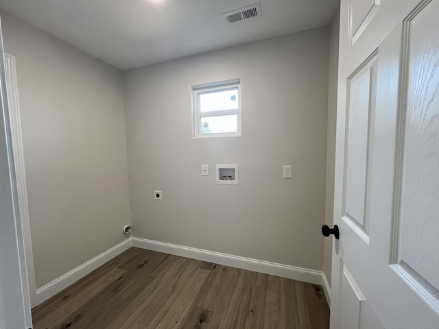 clothes washing area featuring hookup for an electric dryer, hookup for a washing machine, and dark hardwood / wood-style flooring