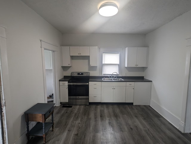 kitchen featuring sink, white cabinets, and stainless steel range with electric stovetop