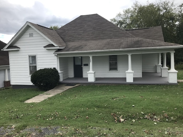 view of front of home featuring a porch and a front yard