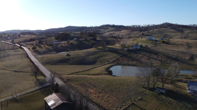 bird's eye view featuring a water view and a rural view