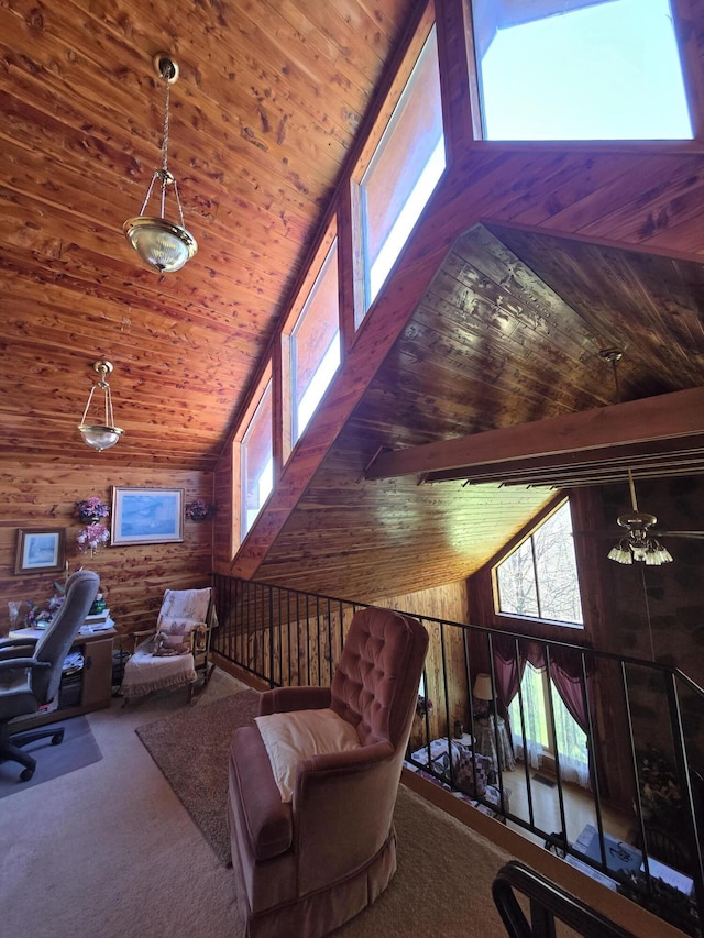 carpeted home office featuring wood walls, high vaulted ceiling, and wood ceiling