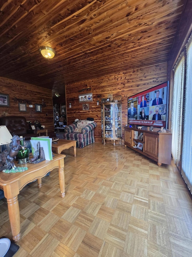 living area featuring wood walls and a wealth of natural light