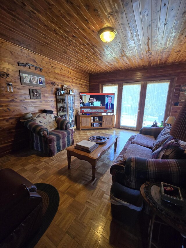 living area featuring wooden walls and wood ceiling
