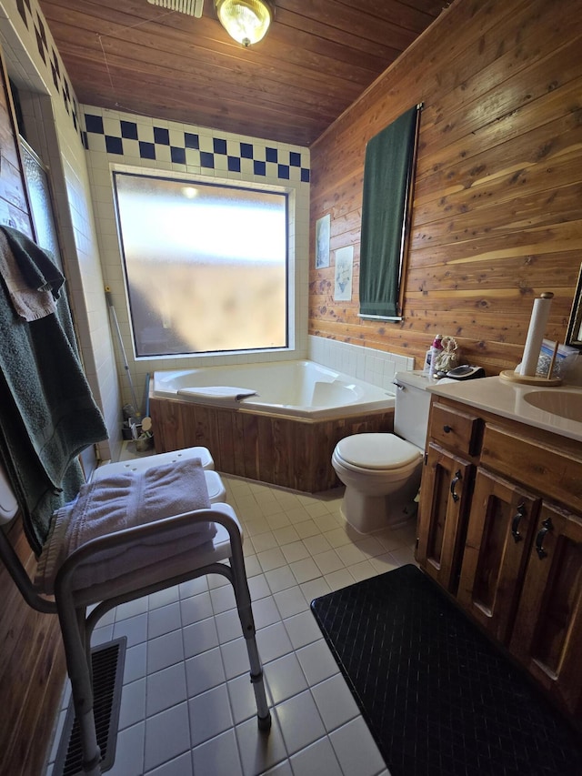 full bathroom with a bath, tile patterned flooring, toilet, wooden ceiling, and wooden walls