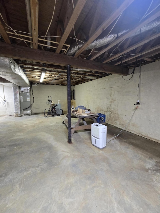 unfinished below grade area featuring heating unit