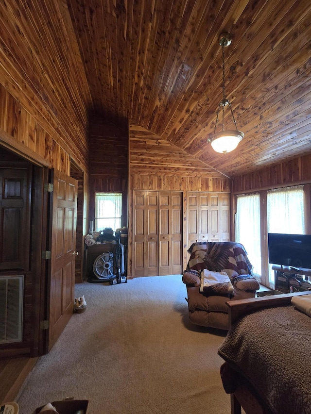 carpeted bedroom with wood ceiling, wood walls, lofted ceiling, and visible vents