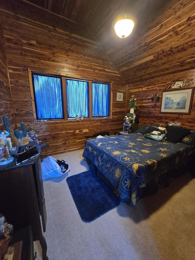bedroom featuring wooden walls, carpet flooring, and lofted ceiling