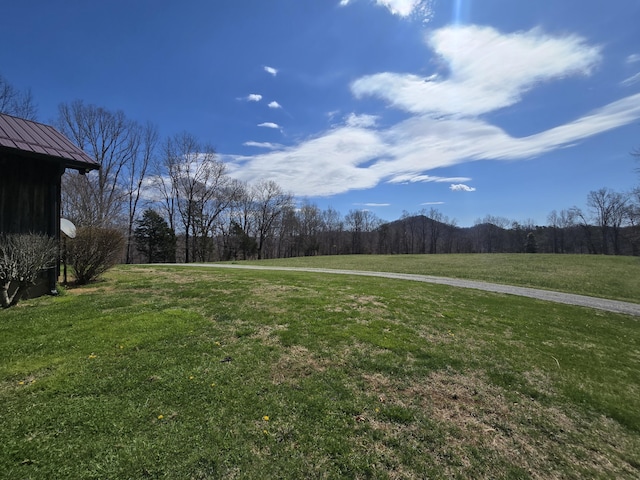 exterior space featuring a forest view