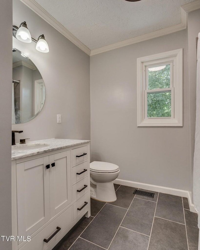 full bathroom featuring visible vents, toilet, ornamental molding, a textured ceiling, and vanity