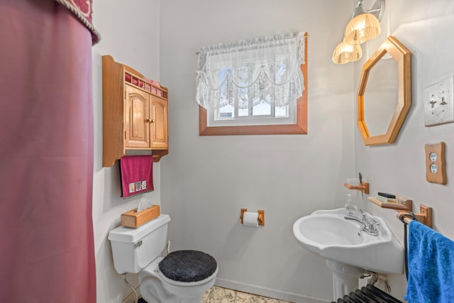 bathroom with toilet and sink