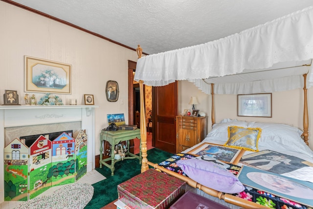 bedroom featuring crown molding, carpet, and a textured ceiling