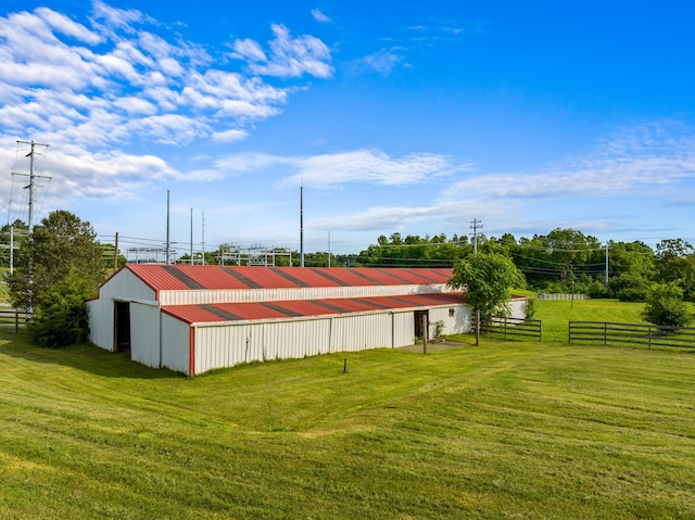 exterior space featuring an outbuilding and a lawn